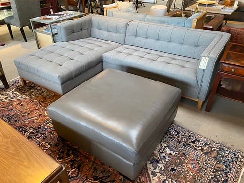 Gus Modern 2 Piece Tufted Sectional with Chaise - $899
Room and Board Leather Ottoman Grey with Wood Boxed Legs Java Finish - $199